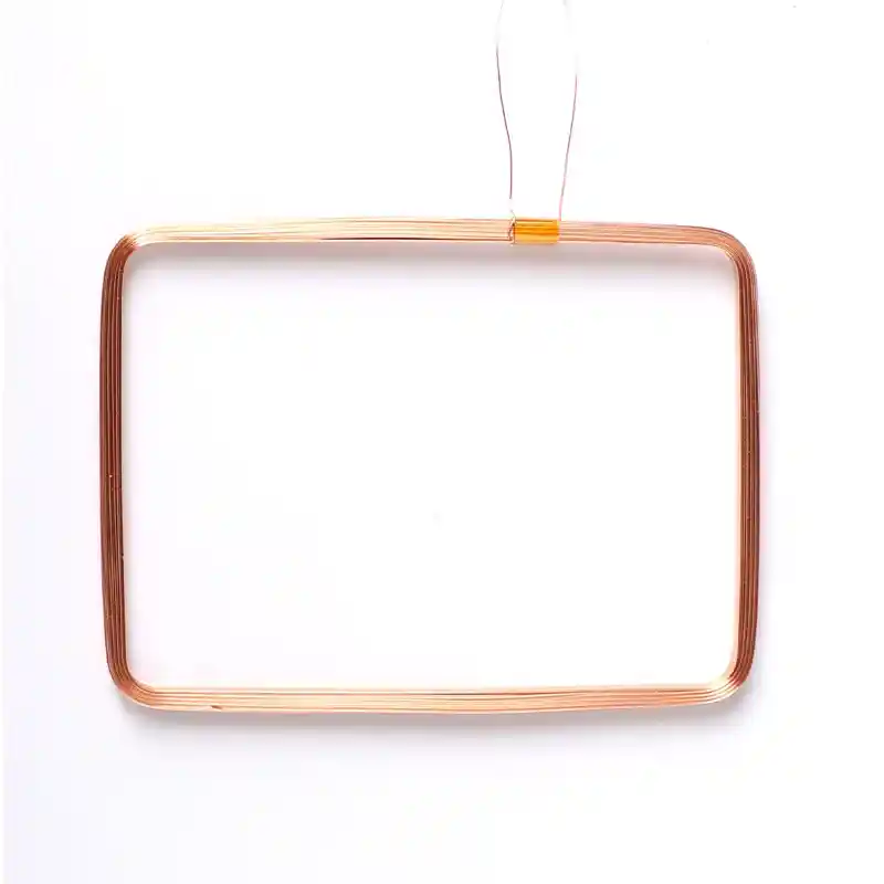 Rectangular wound coil with rounded corners and two leads exiting from one long side
